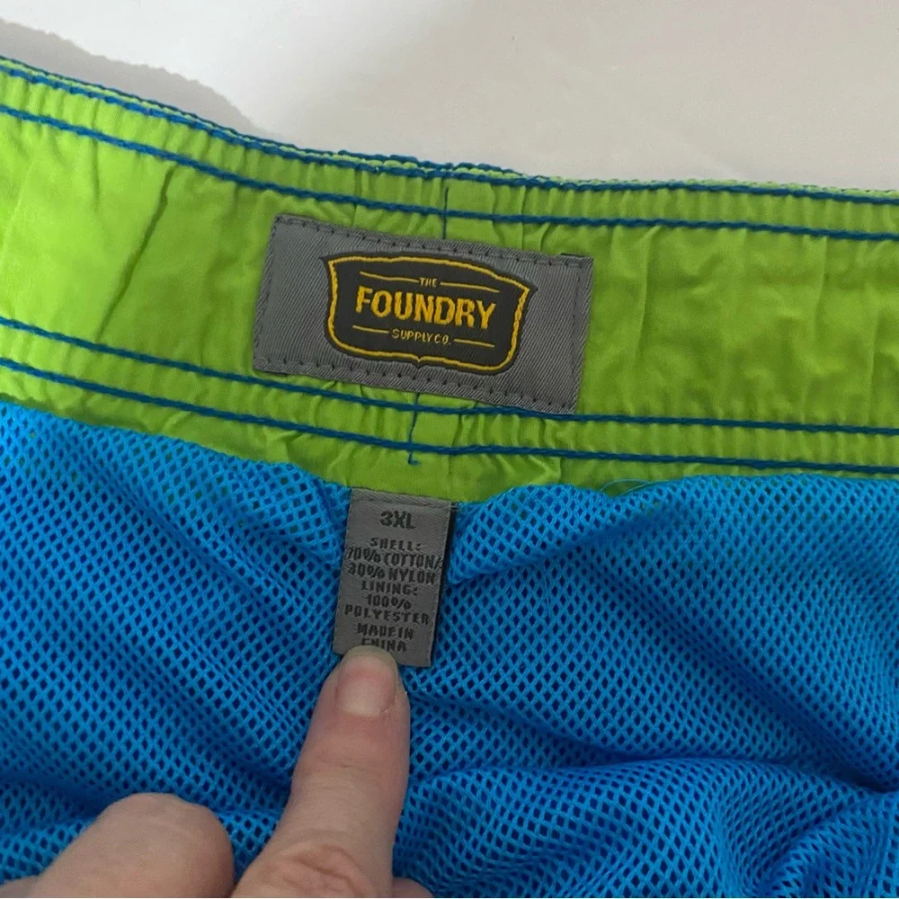 Men’s The Foundry Supply Co blue with green swim trunks. 3XL